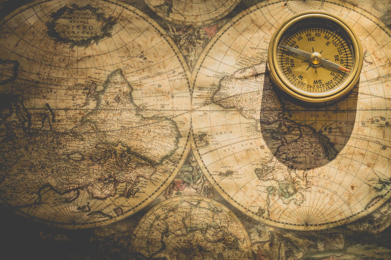 Antique map with a compass, symbolizing exploration and navigation.